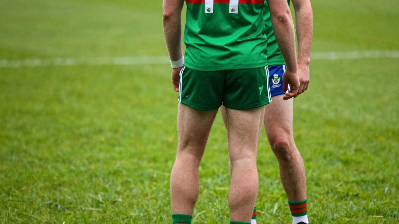 GAA player wearing a full team kit on a green grass sports pitch in Ireland