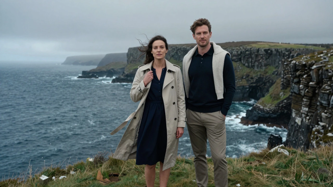 Couple in stylish layers standing on a windy Irish cliff edge
